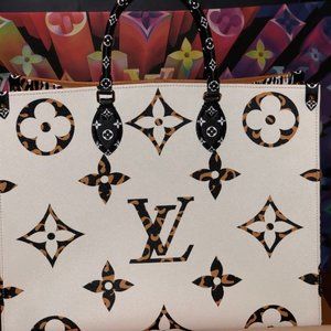AUTHENTIC LOUIS VUITTON ON THE GO JUNGLE GM- IVORY